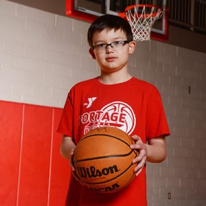 boy holding basketball